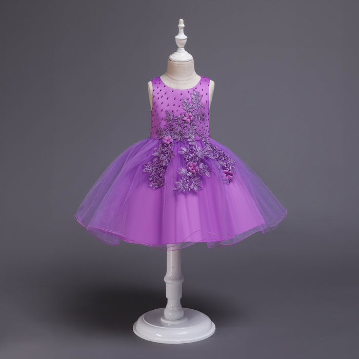 Girls sleeveless dress with floral embroidery on sweet solid coloured fabric