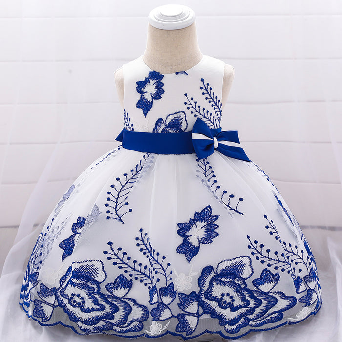 Solid colored baby girls dress with floral embroidery and sleeveless design